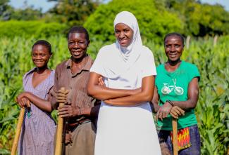 Nurse Jalia Rwinza stands with several women