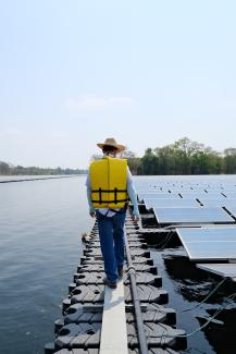 SCG technical officer led participants in knowledge transfer between EGAT-MEA-PEA and EPPO's Study Tour to visit the Electricity Utility of Thailand, as part of promoting a South-South exchange, along the floating path next to the floating Solar PV at SCG Floating Solar, Saraburi Province, Thailand. The solar panels used have been claimed to last longer than 25 years and are made from HDPE plastic, which is recyclable and durable against ultraviolet light. Since HDPE plastic is categorized as food grade pl