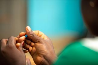 Nurse testing a woman for Anemia