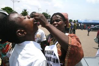 A child receives an oral polio vaccine