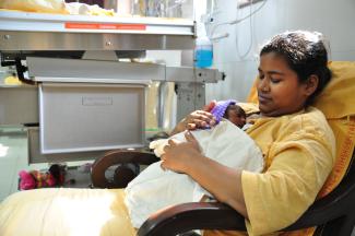 Sadhna performing Kangaroo Mother Care after her delivery