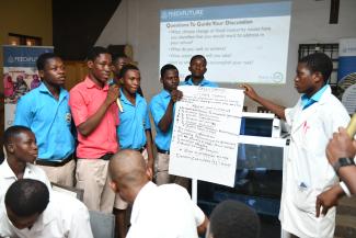 Students of Kaleo Senior High Technical School present their action plan to address climate change in their school environment during a USAID-supported climate action training