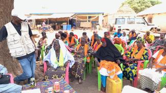 Bebe Camara, wearing white scarf, is one of the women leaders in the Nafadji community. She explains the positive impact of the VSLA on community members.