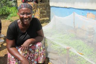 Respect shows off her newly grown peppers