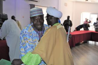 Two men embrace at the intra-Muslim PVE training. 