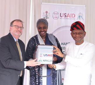 U.S. Ambassador Richard Mills with Ms Daju Kachollom MNI, Permanent Secretary, Federal Ministry of Health and Dr. Muyi Aina Executive Director and CEO of National Primary Healthcare Development Agency, handing over 10,000 doses of mpox vaccine sponsored by USAID