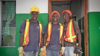 Three men wearing safety gear