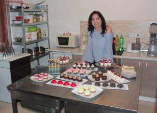 Silvana Vidović with goods she baked in her kitchen in Livno, Bosnia and Herzegovina. 