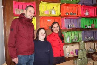 Businessowner Irma Zerdo, right, with employees Edin Islamović and Berina Zerdo, in front of Cvetak's display of herbal teas