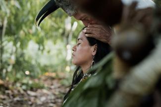 A young indigenous woman taking part on a traditional ritual