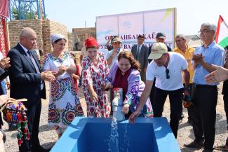 a group of people at a well