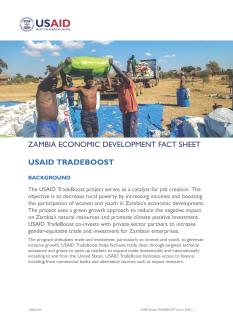 Zambian men load a truck with bags of grain in this thumbnail for the TradeBoost fact sheet