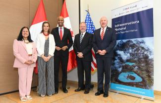 USA Charge D'Affairs in Peru, John McNamara, Canadian Minister of International Development, Ahmed Hussein, and Peruvian Minister of Environment, Albina Ruiz, during the announcement of the announce the extension of Natural Infrastructure for Water Security project.