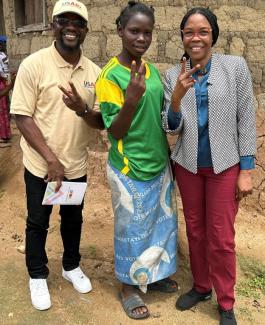 Watta Sagno, center, with USAID Guinea Democracy and Governance team.