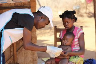 A baby receives medical treatment