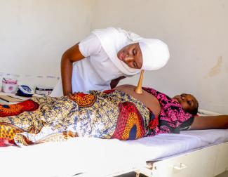 Nurse Jalia Rwinza attends to a patient