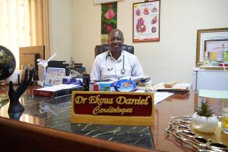 Biyem-Assi District Hospital in his office with a smile- Universal Health Coverage and HIV patients- Photo by Timothe MSH