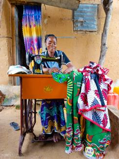 Genevieve happily working with her sewing machine