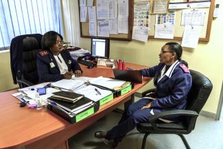 Claudia Kambonde (left) discusses the work roster with Sr. Rosemarie Masule (right). Kambonde coordinates 700 nurses at Windhoek’s Central Hospital.