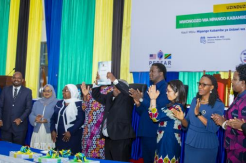 The Minister of State at the President’s Office, Hon. Capt. George Mkuchika showing the CCSWOPG during a launch event.