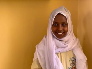 Fatma, 13, has been able to return to school through USAID assistance.