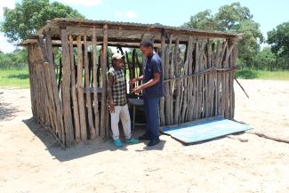  Ready for the smart-cut: A VMMC client discusses the advantages of circumcision with a nurse at the outreach room.