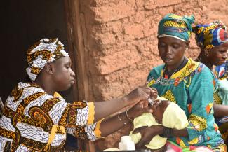 A child receiving a vaccine in the village de Kardiasso_ credit I. Kamaté/URC