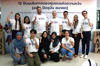 USAID and Chumchon Harapan staff members pose for a group photo. 