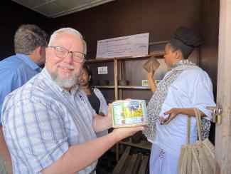 USAID DAA Mike Michener showing one of Celine's licking blocks