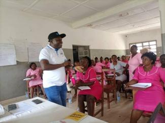 Mr. Micheal A N’dolie from District Health Management Team facilitating the PMI supported capacity building session for Primary Health Unit staff in Pujehun District, Southern Sierra Leone. 