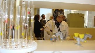 Tripoli Quality Control Center staff tests a sample of processed food. Processed foods often tested in the lab include: olive oil, jams/preserves, chickpeas and fresh meat.