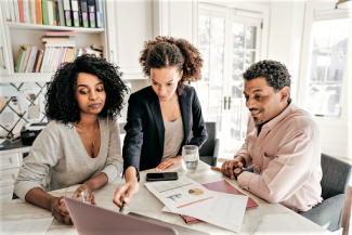 Three people working together