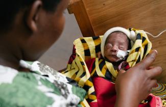 Woman holding infant