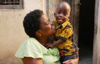 Woman carrying toddler