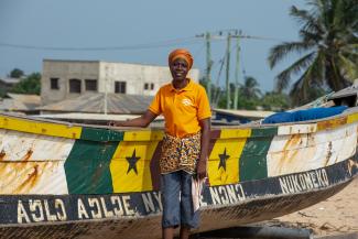 Bernice Dzanyekpor by her fishing vessel