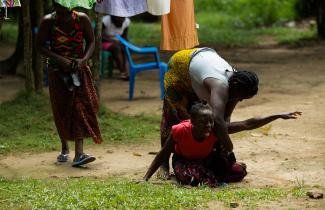 A girl cries on the ground