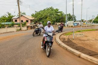 Adama sometimes travels on her motorcycle to visit patients at their homes in northern Ghana. 