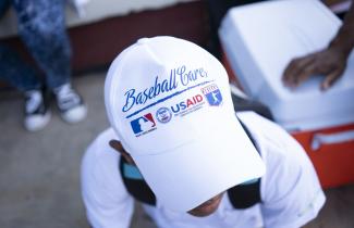 A close up of a baseball cap that reads "Baseball Cares"