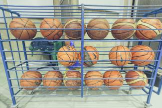 A container of basketballs that PeacePlayers uses for their practices.