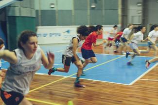 A PeacePlayers basketball team practice session.