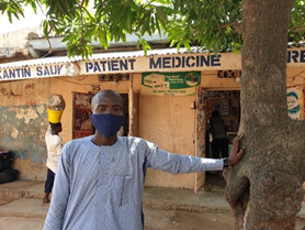 Zayyano, a roaming screener for the SHOPS Plus TB program in Kano, outside of the Kandi Sauki PPMV where he screens clients