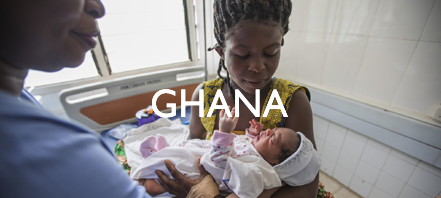 A mother in Ghana holds a newborn.