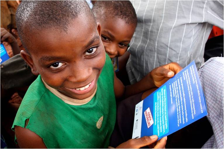 
 A young boy looks at a tablet