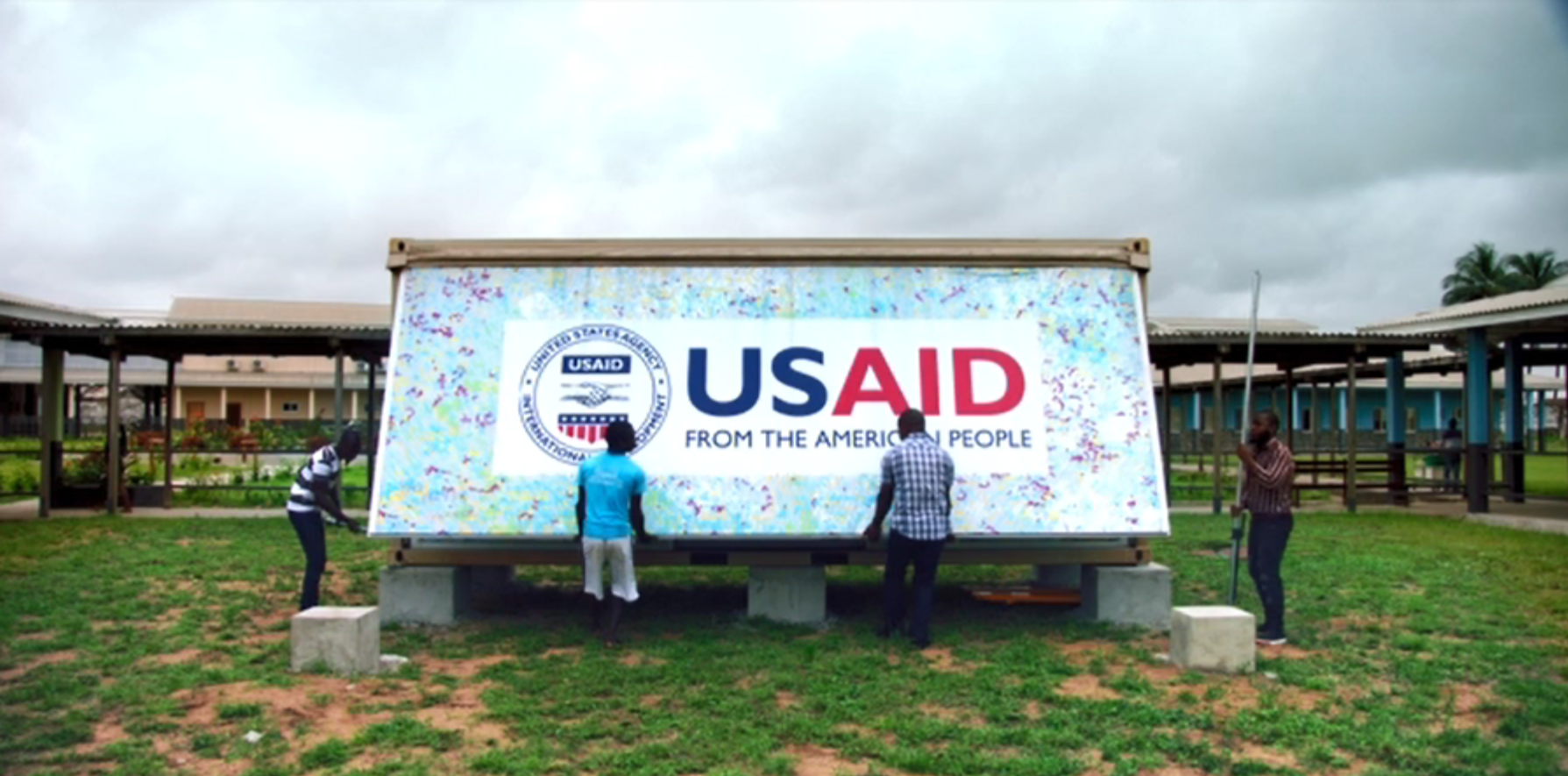 Men working in Liberia to set up the Ebola Grand Challenge pod.