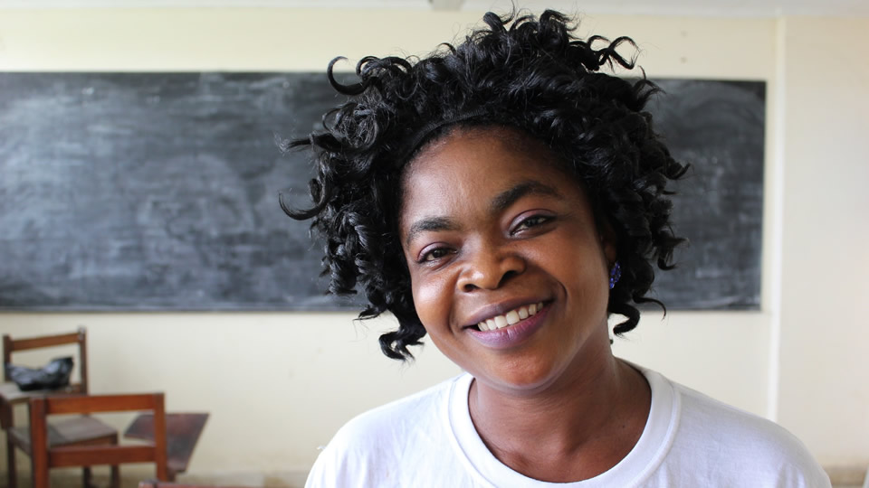 Banner photo of a smiling woman. Photo credit: Liz Eddy/MCSP